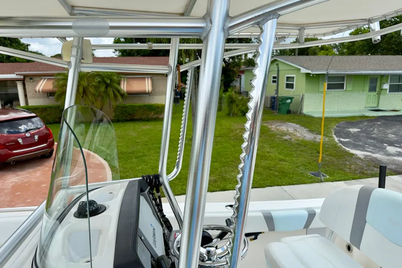 Slide: The Image of 2020 Robalo R230 Center Console boat interior with steering console and seating. - 20