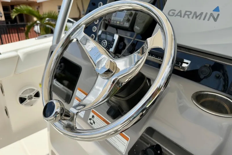 Slide: The Image of Steering wheel of 2020 Robalo R230 Center Console boat with Garmin navigation system. - 8