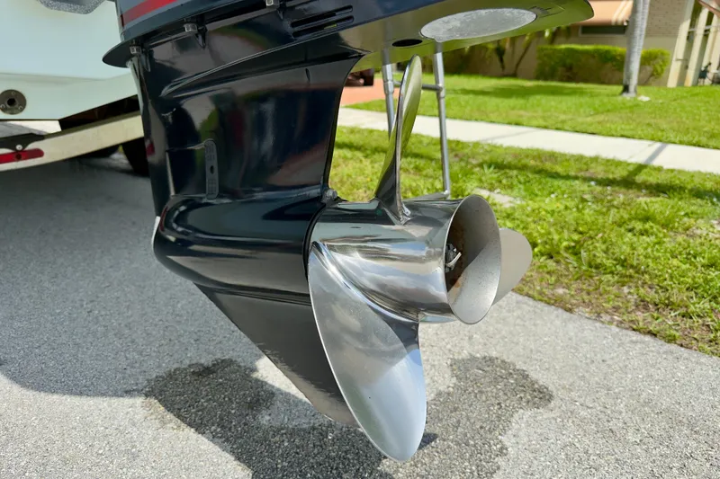 Slide: The Image of Close-up of a 2020 Robalo R230 Center Console boat propeller on pavement. - 54