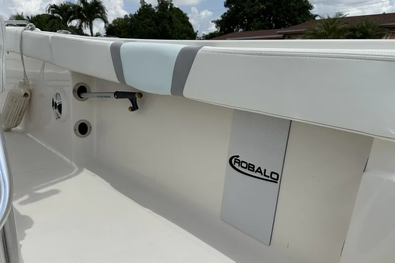 Slide: The Image of 2020 Robalo R230 Center Console boat interior with branded panel and seating. - 28
