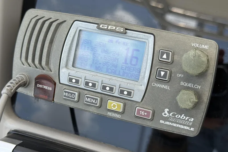 Slide: The Image of Cobra Marine GPS radio on 2020 Robalo R230 Center Console boat dashboard. - 13
