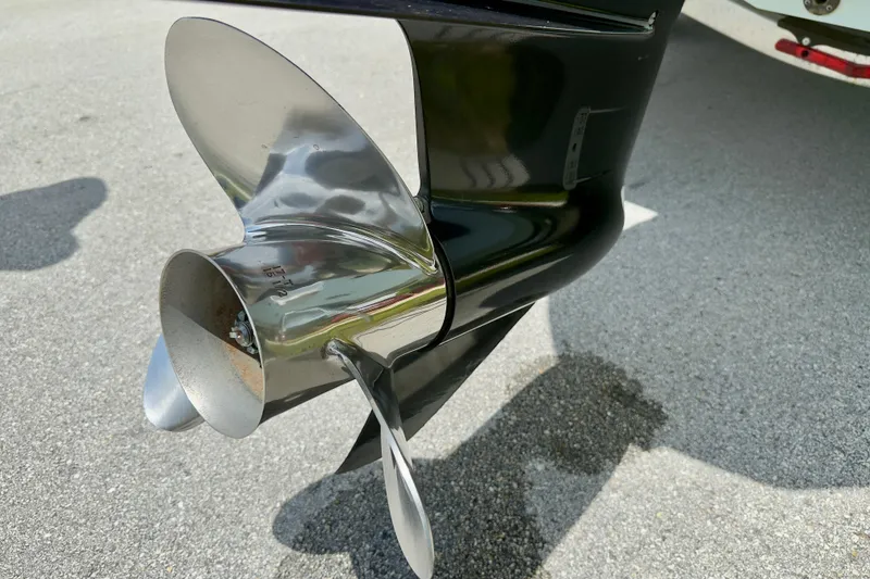 Slide: The Image of Close-up of a 2020 Robalo R230 Center Console boat propeller on pavement. - 55