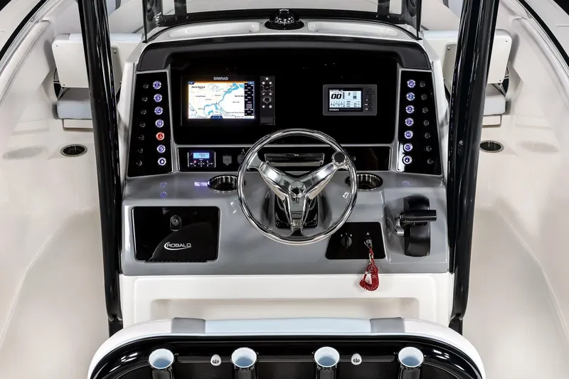Slide: The Image of Manufacturer Provided Image: 2020 Robalo R230 Center Console boat dashboard with navigation screens and steering wheel. - 73