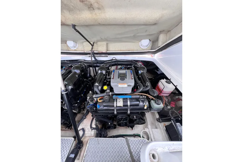 Slide: The Image of Engine compartment of a 2015 Formula 330 Crossover Bowrider boat. - 19