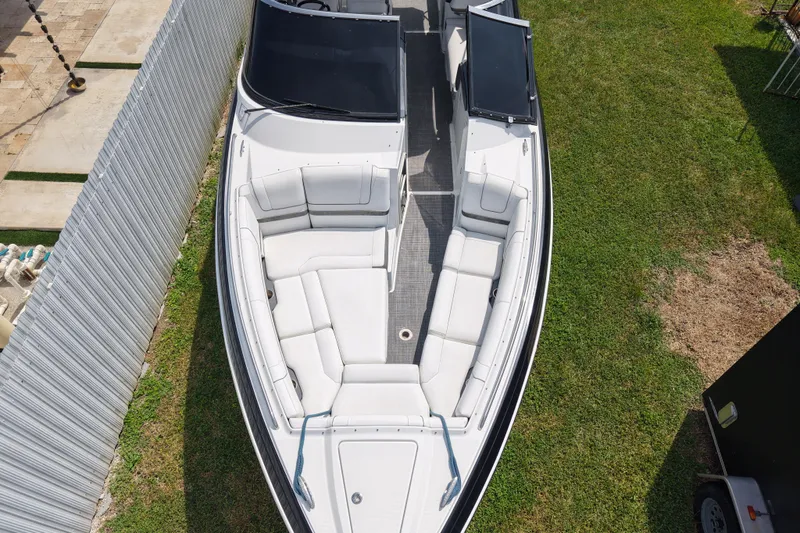 Slide: The Image of Overhead view of a 2015 Formula 330 Crossover Bowrider on grass. - 5