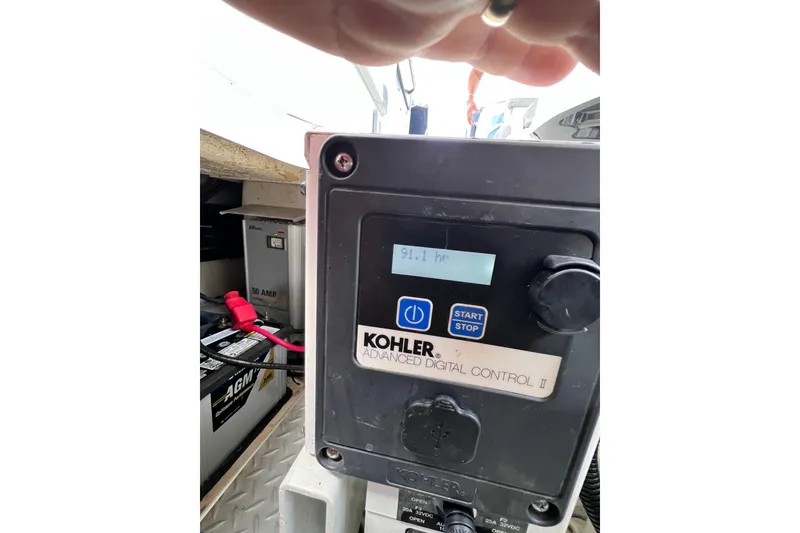 Slide: The Image of Kohler Advanced Digital Control panel on 2015 Formula 330 Crossover Bowrider boat. - 14