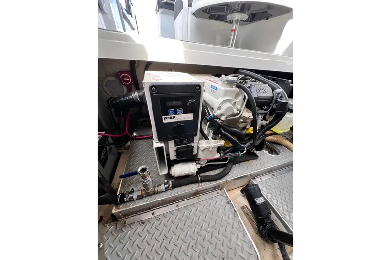 Slide: The Image of Engine compartment of a 2015 Formula 330 Crossover Bowrider with Kohler generator. - 16