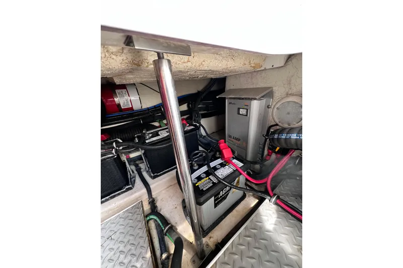 Slide: The Image of Engine compartment of 2015 Formula 330 Crossover Bowrider with battery and wiring. - 15