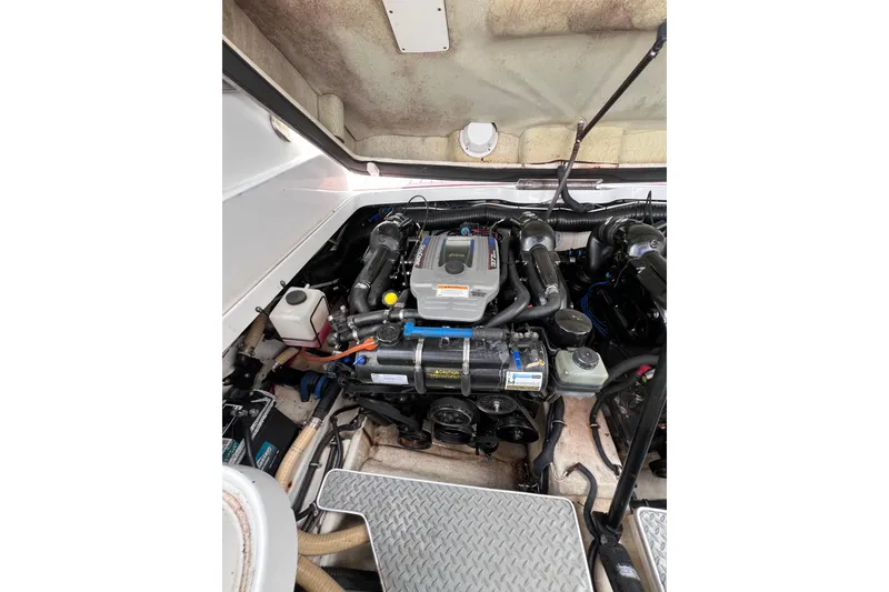 Slide: The Image of Engine compartment of a 2015 Formula 330 Crossover Bowrider boat. - 18