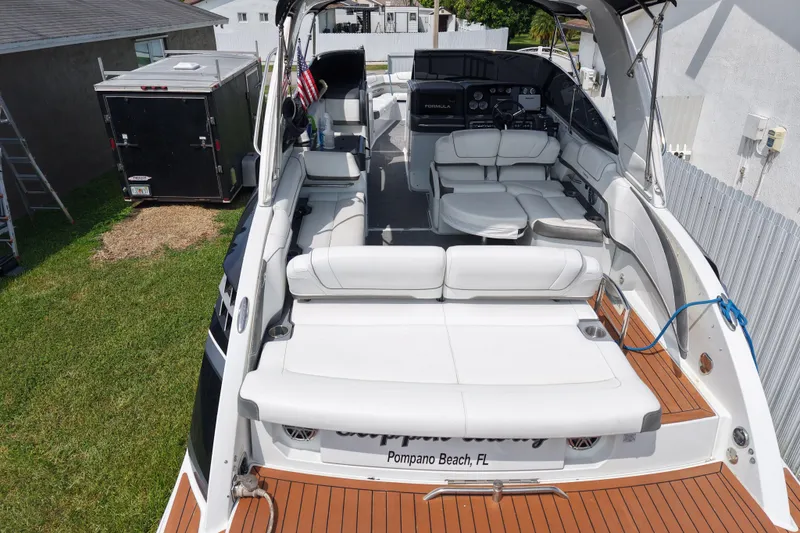 Slide: The Image of 2015 Formula 330 Crossover Bowrider with spacious seating, docked in Pompano Beach, FL. - 4