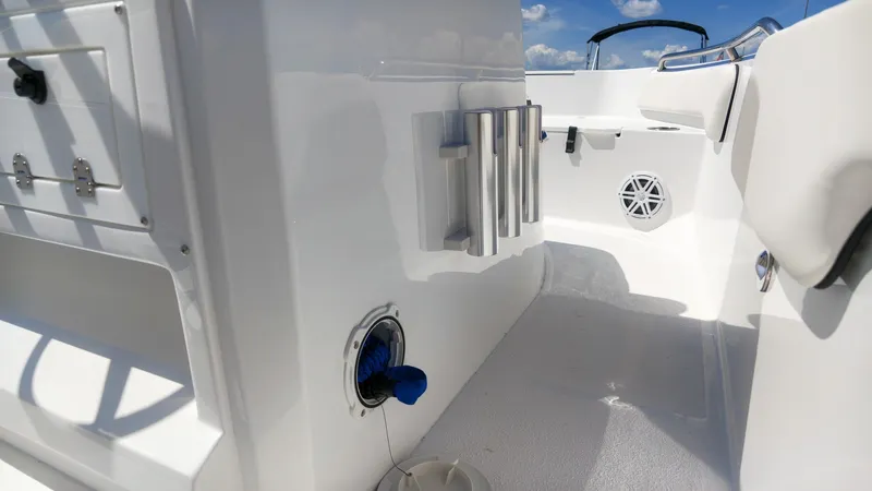 Slide: The Image of The image shows the cockpit of a Stingray 17 CC boat with white surfaces and stainless steel details. - 14