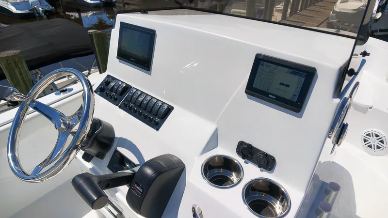 Slide: The Image of The image shows the helm of a Stingray 17 CC boat with modern instruments and controls. - 11