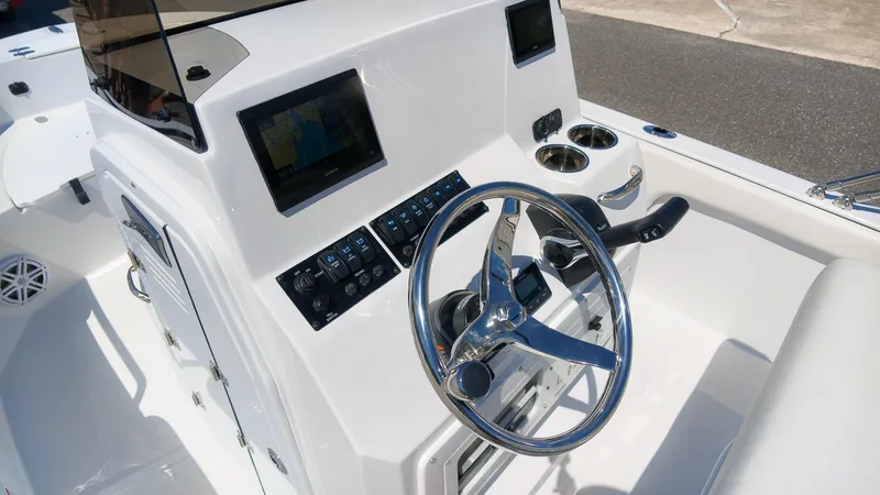Slide: The Image of The image shows the cockpit of a 2027 Stingray 17 CC boat with a modern helm. - 11