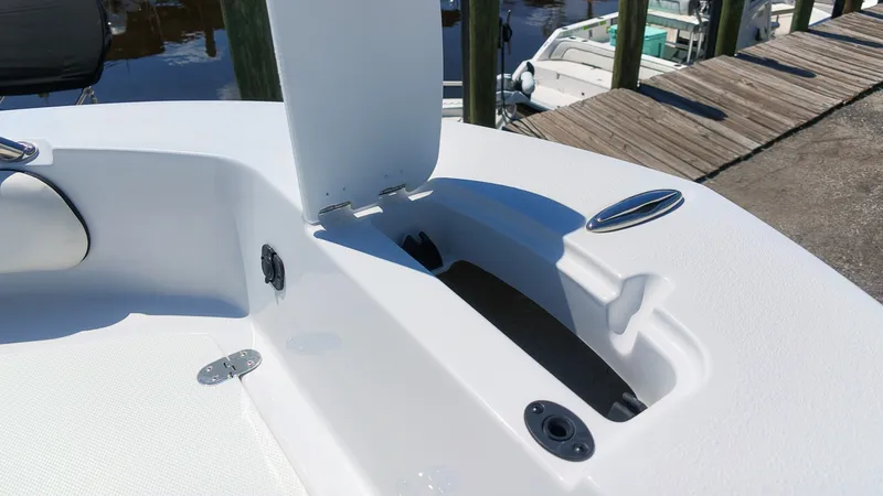 Slide: The Image of The image shows the bow of a Stingray 17 CC boat with an open storage compartment. - 16