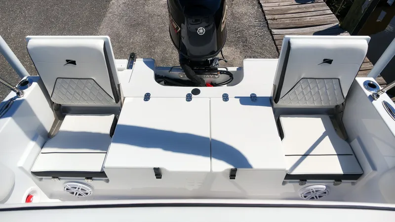 Slide: The Image of The image shows the cockpit of a Stingray 17 CC boat with two cushioned seats and an outboard motor. - 6