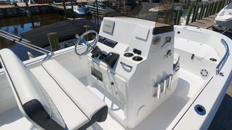Slide: The Image of The image shows the cockpit of a 2027 Stingray 17 CC boat with a modern helm station. - 4