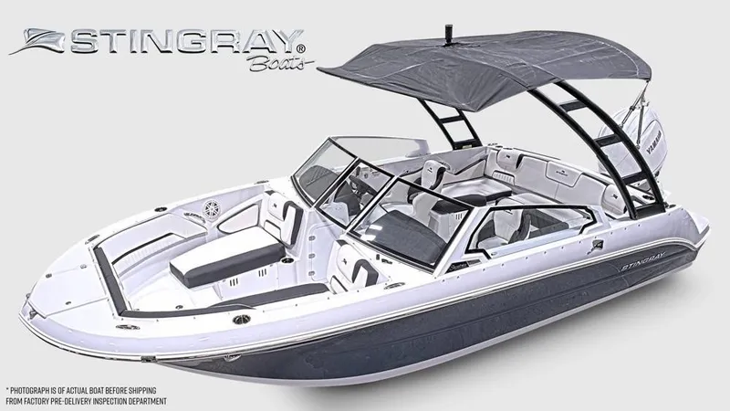 Slide: The Image of A modern Stingray 20 SBX bowrider with a gray canopy and sleek design. - 6