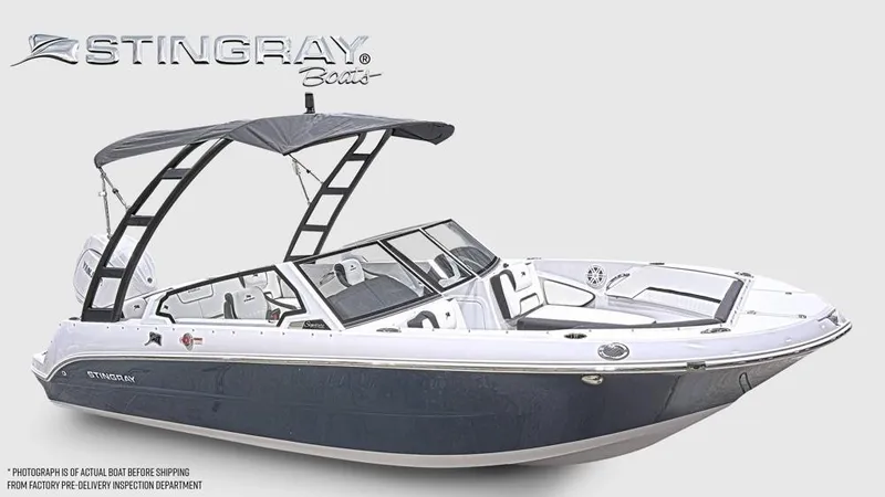 Slide: The Image of The image shows a modern Stingray 20 SBX boat with sleek design and a sunshade. - 8