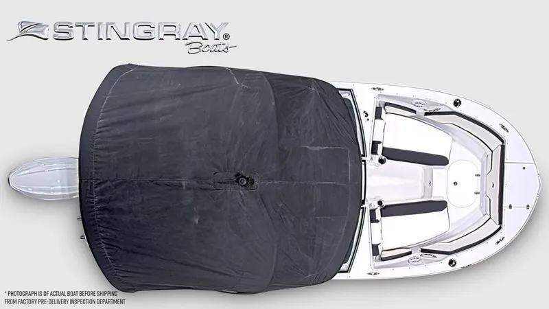 Slide: The Image of Aerial view of a Stingray 20 SBX boat with cover, showing deck and seating arrangement. - 6