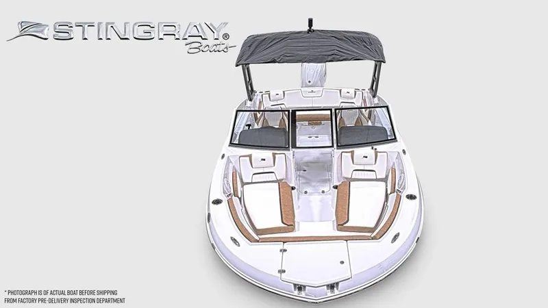 Slide: The Image of The image shows a modern Stingray 20 SBX boat with a black sunshade and comfortable seating. - 7