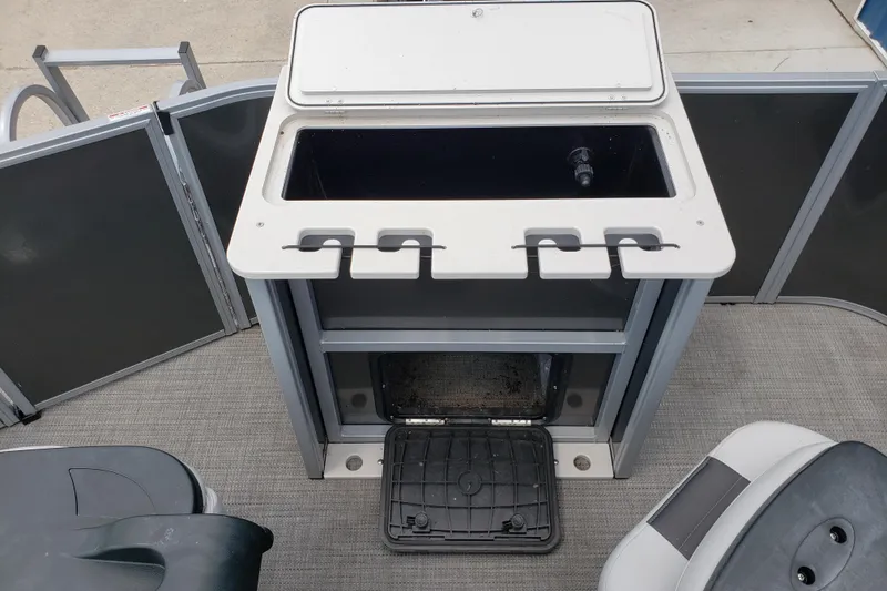 Slide: The Image of 2023 Bentley Pontoons 223 4 Party Fish interior with storage and seating area. - 13