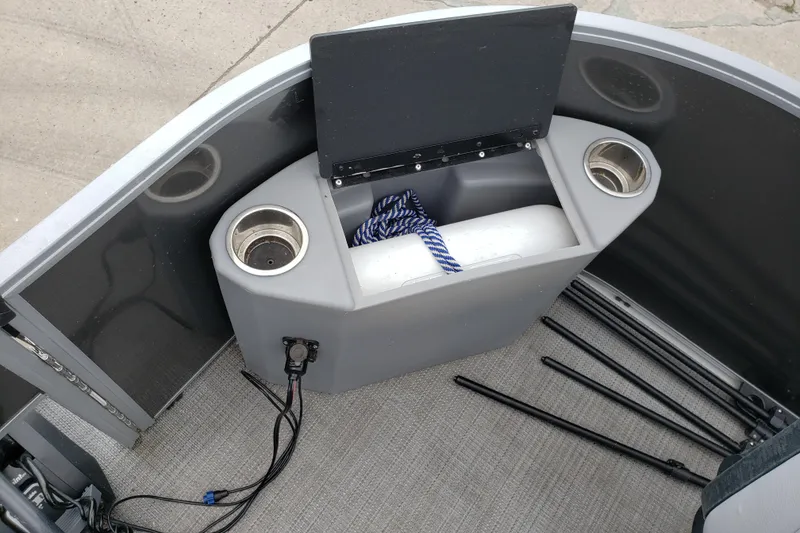 Slide: The Image of 2023 Bentley Pontoons 223 4 Party Fish interior with cup holders and storage compartment. - 17