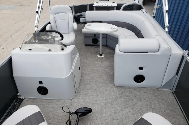 Slide: The Image of 2023 Bentley Pontoons 223 4 Party Fish interior with plush seating and steering console. - 8