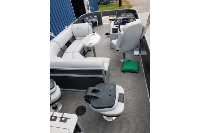 Slide: The Image of 2023 Bentley Pontoons 223 4 Party Fish interior with plush seating and modern helm. - 7