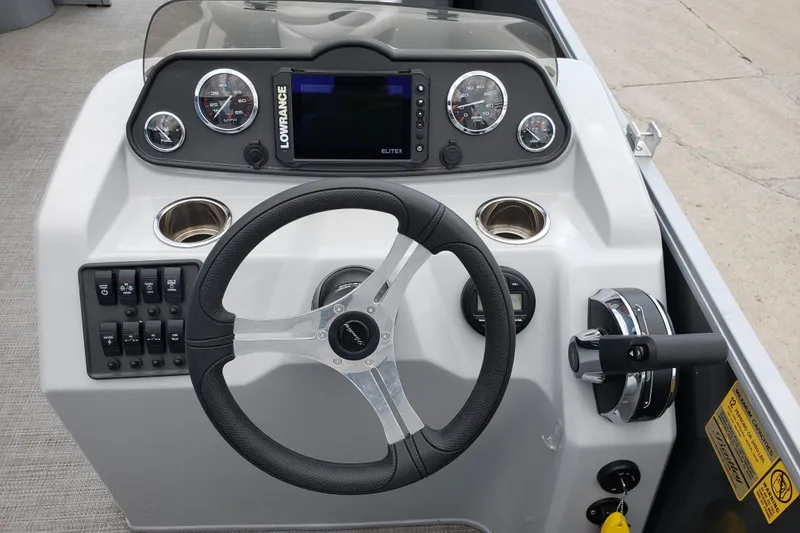 Slide: The Image of 2023 Bentley Pontoons 223 4 Party Fish dashboard with steering wheel and control panel. - 4