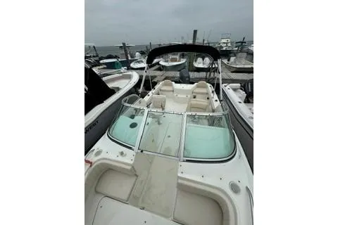 Slide: The Image of 2007 Hydra-Sports Lightning 202 DC boat docked, featuring spacious seating and sleek design. - 8