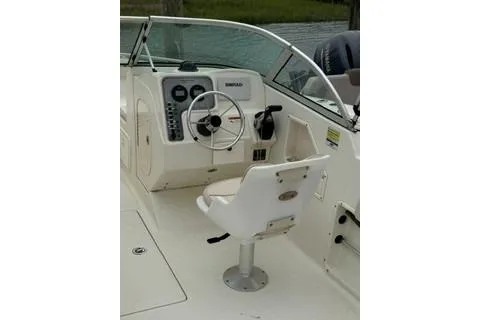 Slide: The Image of 2007 Hydra-Sports Lightning 202 DC boat cockpit with steering wheel and seating. - 3