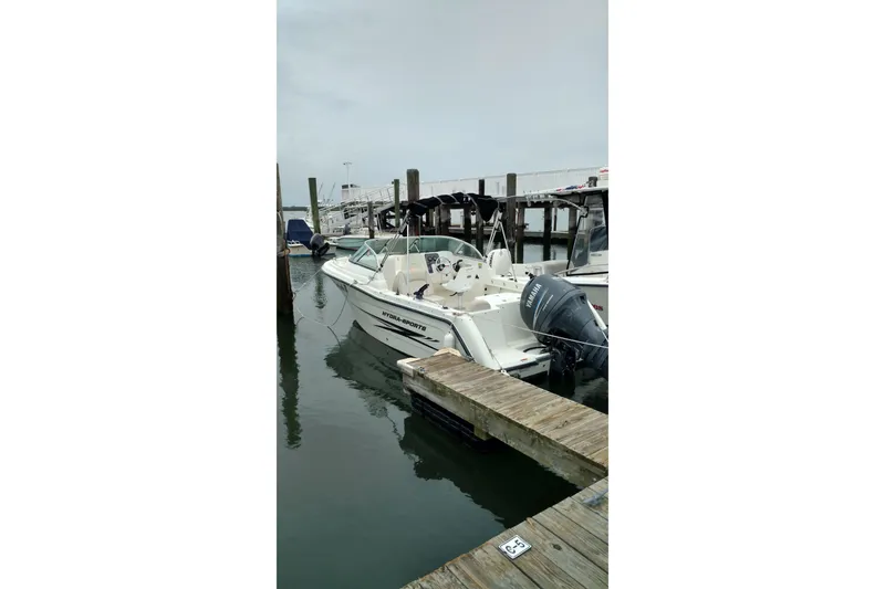 Slide: The Image of Single Owner - 2007 Hydra-Sports Lightning 202 DC boat docked at marina with 150 HP Yamaha outboard motor. - 1