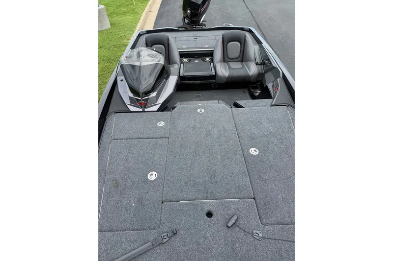 Slide: The Image of 2025 Ranger Z518 Cup-Equipped boat interior with seating and storage compartments. - 10