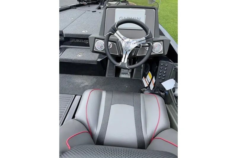 Slide: The Image of 2025 Ranger Z518 Cup-Equipped boat interior with steering wheel and seating. - 7
