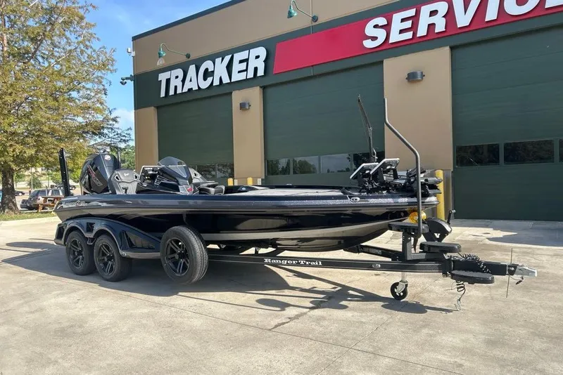 Slide: The Image of 2026 Ranger Z520R boat on trailer outside Tracker service center. - 13