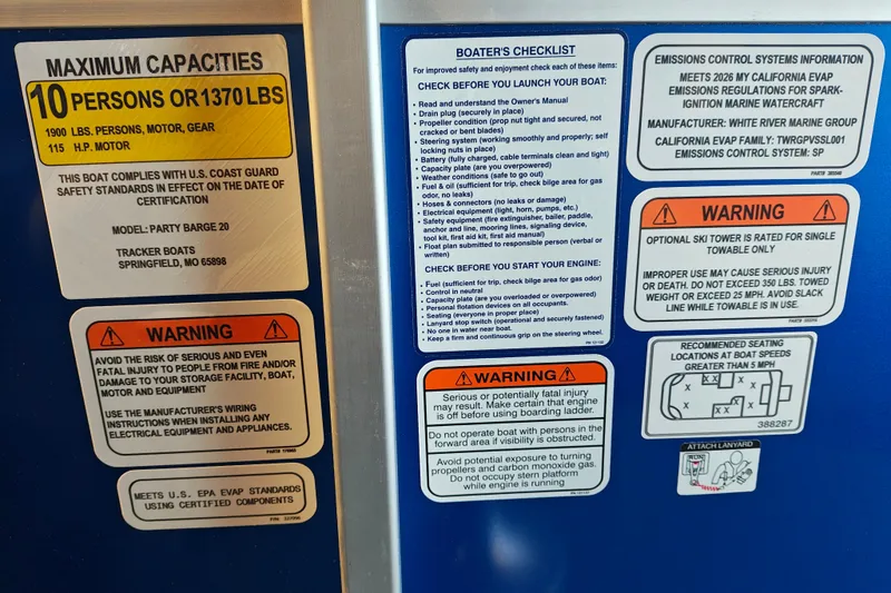 Slide: The Image of Safety and capacity labels on a 2026 Sun Tracker Party Barge 20 DLX boat. - 21