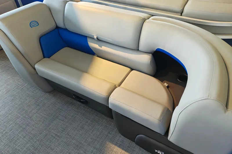 Slide: The Image of 2026 Sun Tracker Party Barge 20 DLX interior seating with gray and blue upholstery. - 4