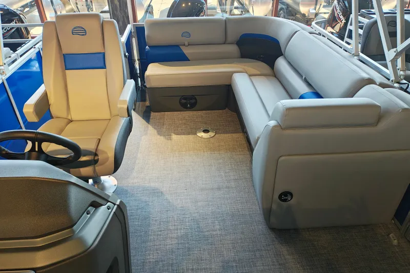 Slide: The Image of 2026 Sun Tracker Party Barge 20 DLX interior with plush seating and modern design. - 9