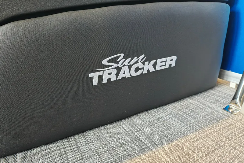 Slide: The Image of Sun Tracker logo on 2026 Party Barge 20 DLX boat interior. - 23