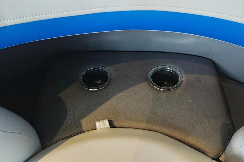 Slide: The Image of 2026 Sun Tracker Party Barge 20 DLX cup holders on cushioned seating. - 5