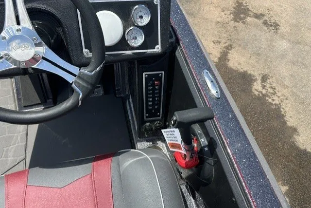 Slide: The Image of Interior of 2026 Ranger Z520 boat with steering wheel and control panel. - 22