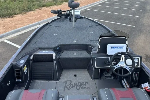 Slide: The Image of 2026 Ranger Z520 boat interior with steering wheel and Lowrance navigation system. - 13