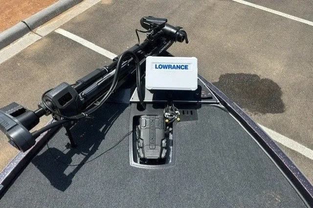 Slide: The Image of 2026 Ranger Z520 boat with Lowrance equipment on deck, parked on asphalt. - 12