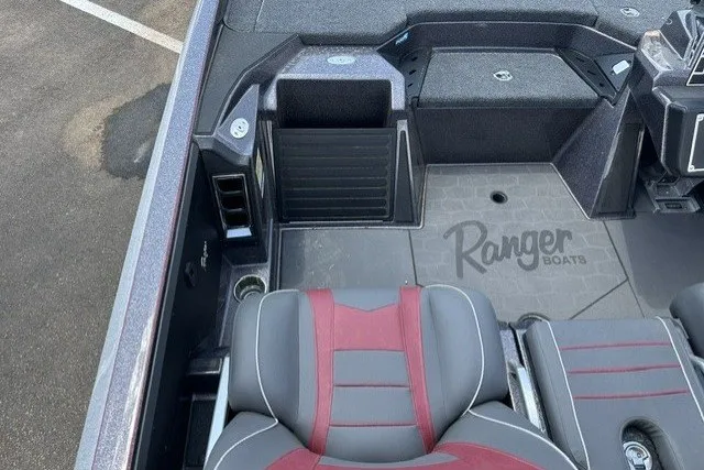 Slide: The Image of 2026 Ranger Z520 boat interior with gray and red seating, Ranger Boats logo visible. - 19
