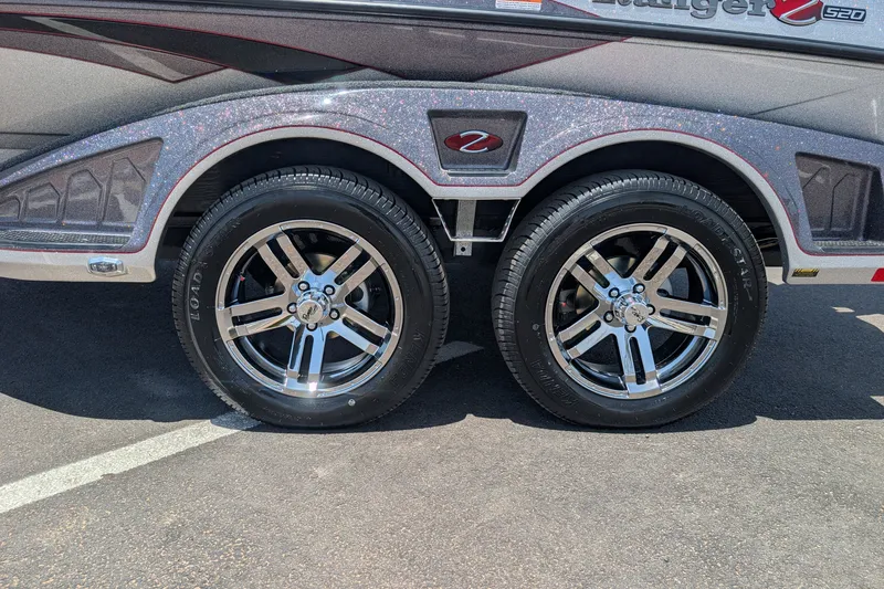 Slide: The Image of 2026 Ranger Z520 boat trailer with shiny chrome wheels and sleek design. - 5