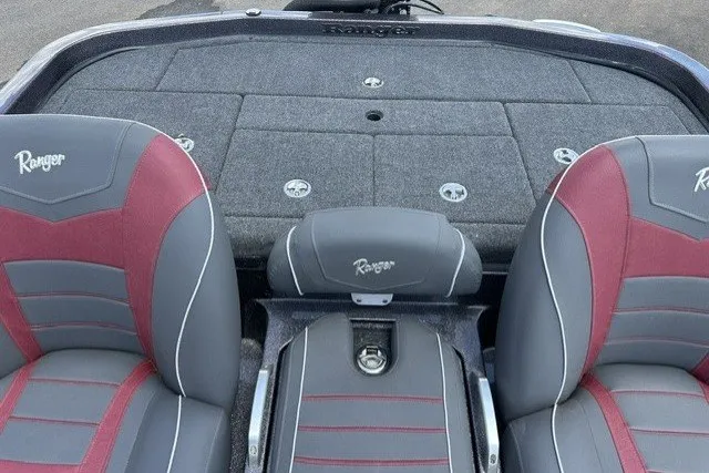 Slide: The Image of 2026 Ranger Z520 boat interior with gray and red seats, featuring Ranger logo. - 16