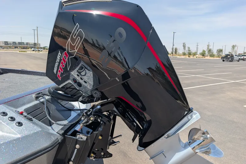 Slide: The Image of 2026 Ranger Z520 boat with Mercury Pro XS outboard motor in a parking lot. - 3