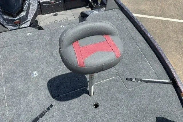 Slide: The Image of 2026 Ranger Z520 boat seat with red and gray upholstery on a carpeted deck. - 14