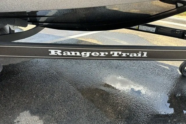 Slide: The Image of 2026 Ranger Z520 boat trailer with "Ranger Trail" branding on wet pavement. - 7