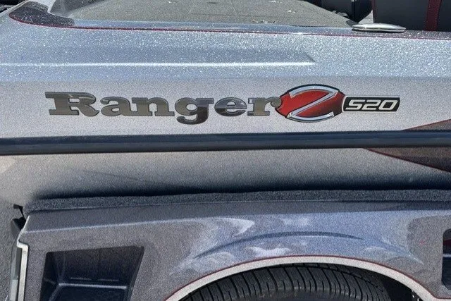 Slide: The Image of 2026 Ranger Z520 boat logo on metallic surface, showcasing sleek design and branding. - 1